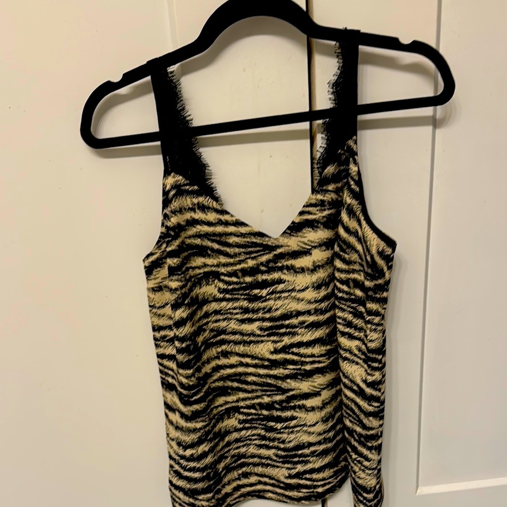 From the express animal, like print cream and black color top